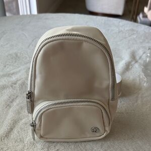 lululemon athletica Cream small 2L sling Bag with Silver Hardware
